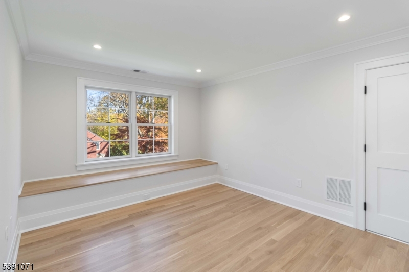 2 Whitman Drive Chatham, NJ 07928 - Photo 39 of 50 an empty room with wooden floor and window
