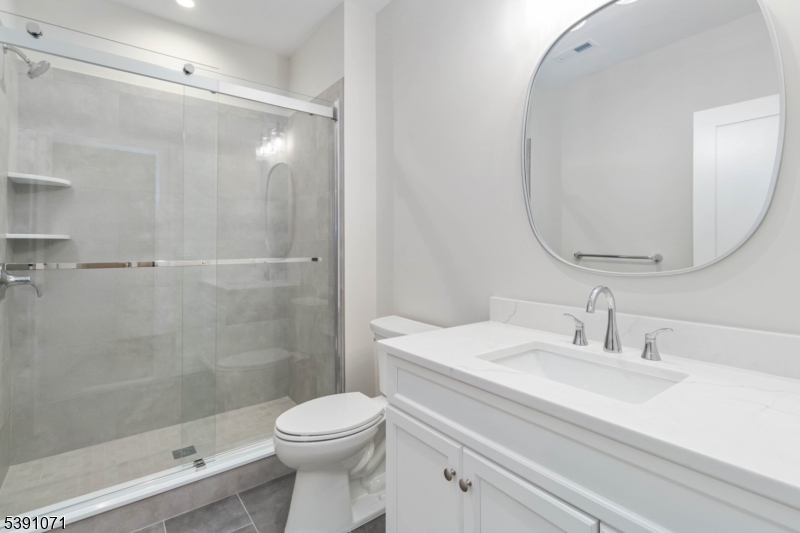 2 Whitman Drive Chatham, NJ 07928 - Photo 45 of 50 a bathroom with a sink a toilet and shower