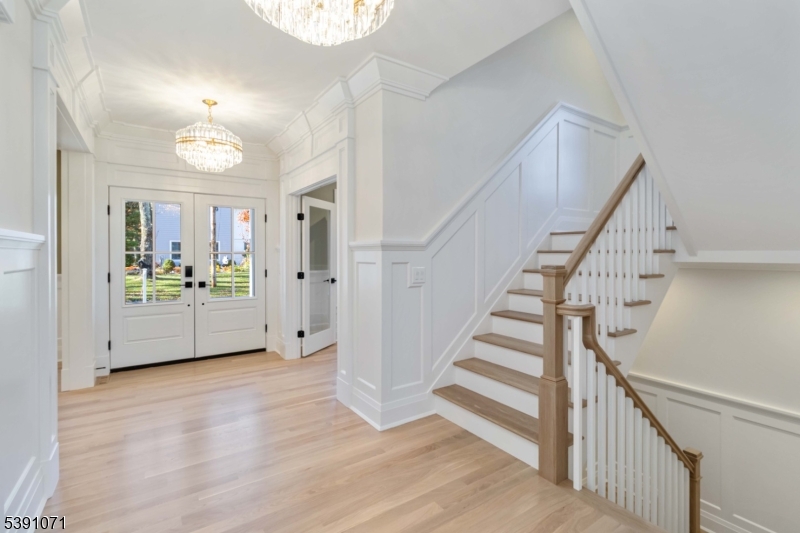 2 Whitman Drive Chatham, NJ 07928 - Photo 5 of 50 a view of an entryway with wooden floor