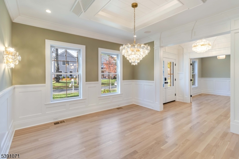 2 Whitman Drive Chatham, NJ 07928 - Photo 10 of 50 a view of an empty room with window and wooden floor