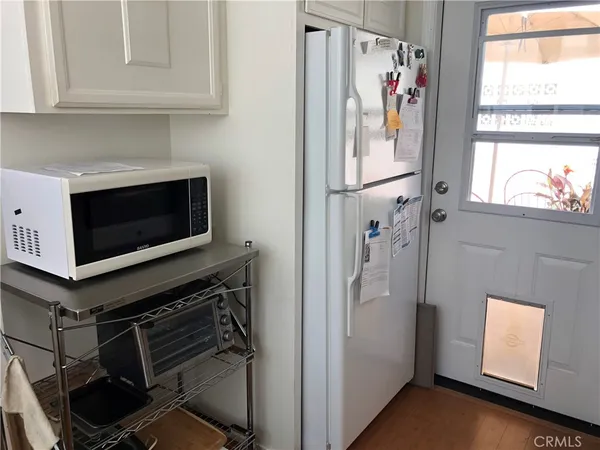 a view of a kitchen with electric appliances