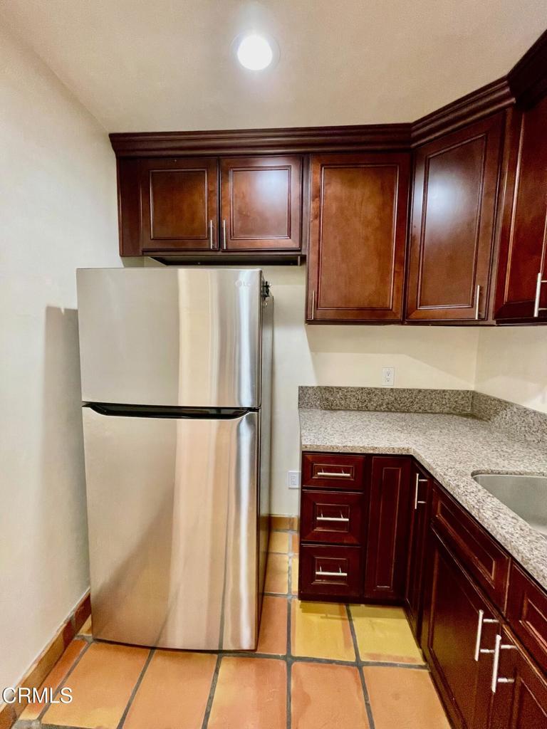 211 Fox Street Ojai, CA 93023 - Photo 23 of 33 a kitchen with stainless steel appliances granite countertop a refrigerator and a sink