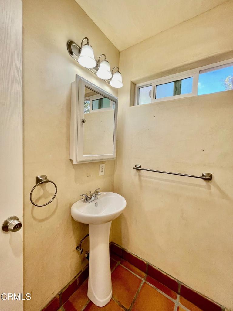 211 Fox Street Ojai, CA 93023 - Photo 27 of 33 a bathroom with a sink mirror and toilet