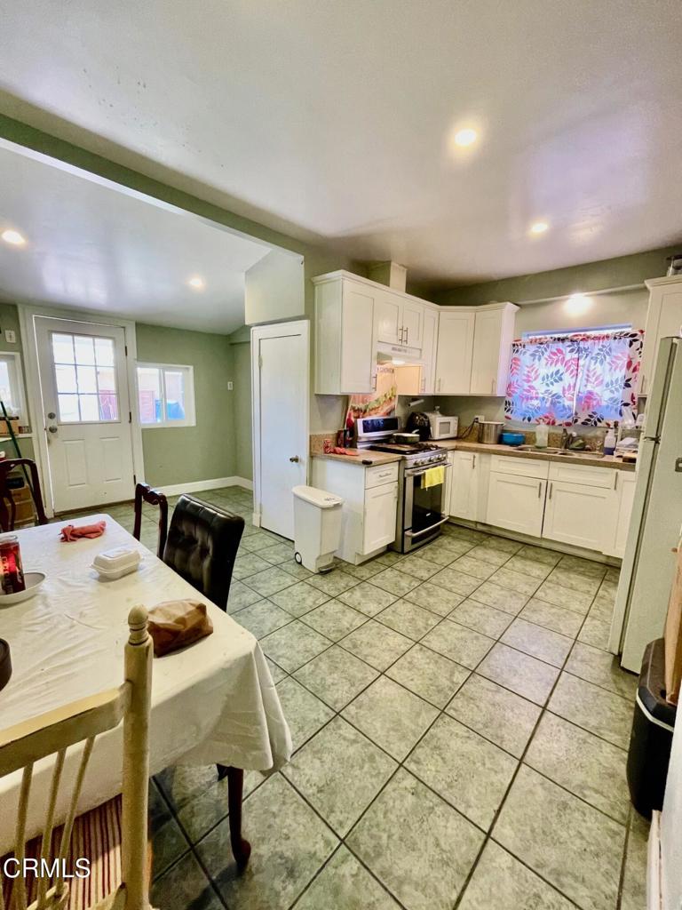 211 Fox Street Ojai, CA 93023 - Photo 5 of 33 a kitchen with stainless steel appliances granite countertop a stove a sink dishwasher and a refrigerator