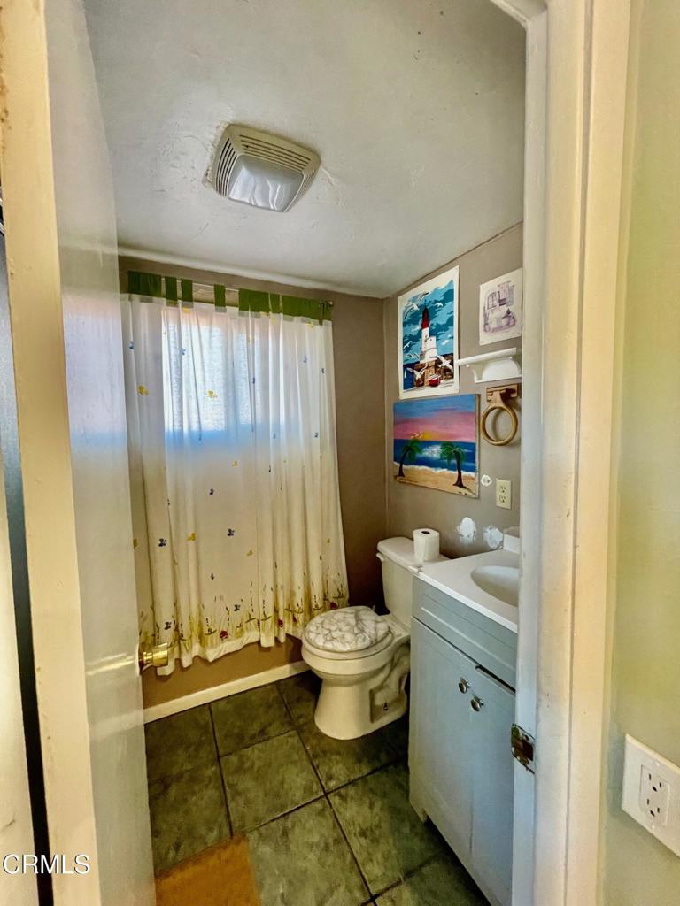 211 Fox Street Ojai, CA 93023 - Photo 8 of 33 a bathroom with a toilet sink and mirror