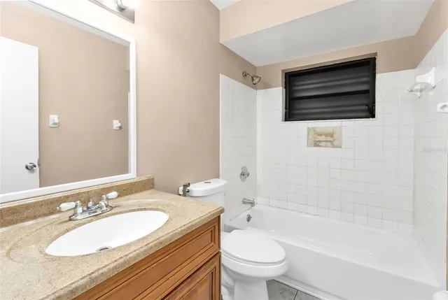 a bathroom with a sink toilet a shower and bathtub