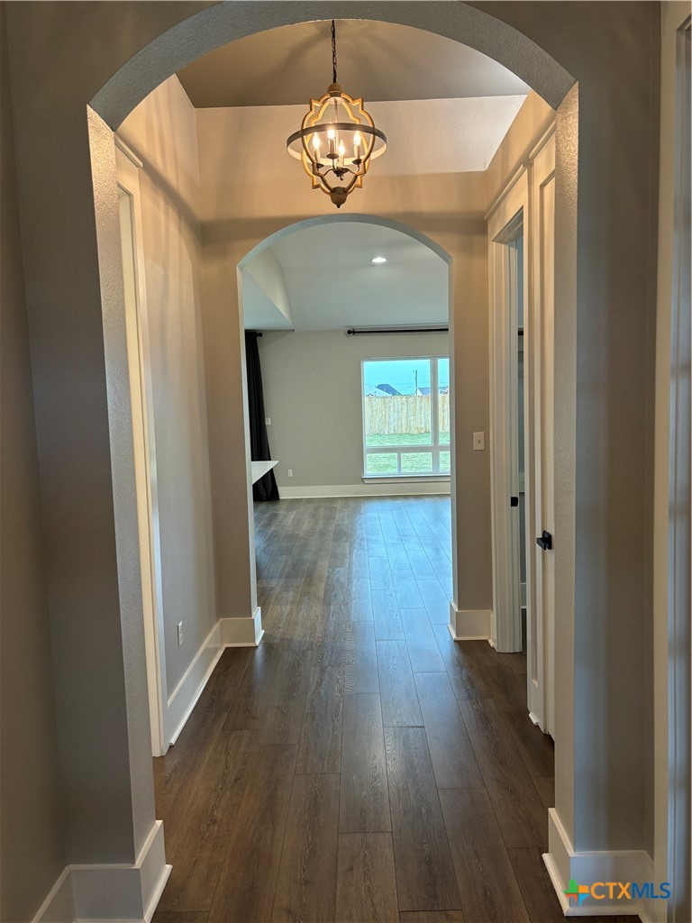 110 Hiram Cook Blanco, TX 78606 - Photo 7 of 46 wooden floor in an empty room with a window