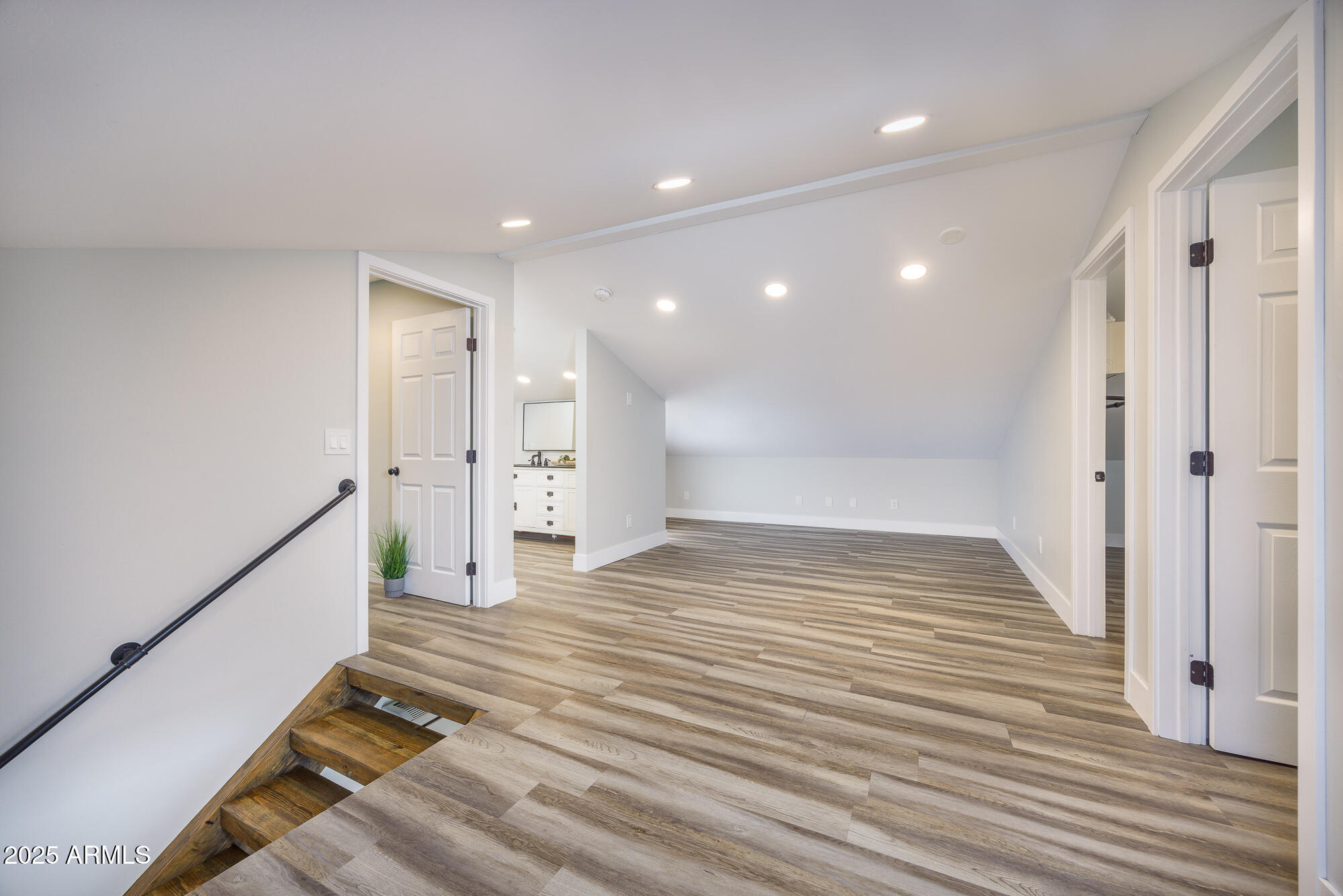 1302 West Coyote Trail Benson, AZ 85602 - Photo 20 of 57 a view of empty room with wooden floor