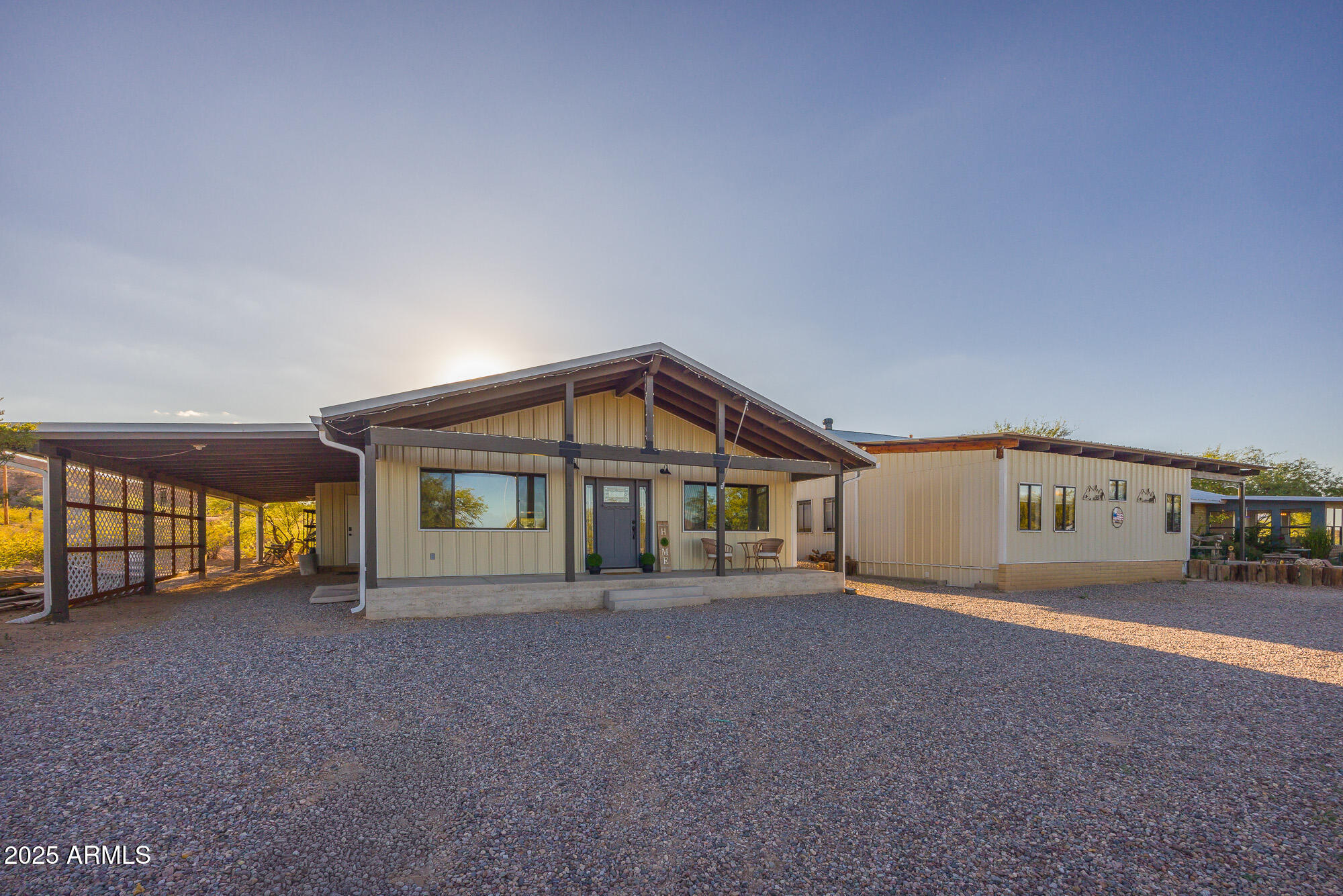 1302 West Coyote Trail Benson, AZ 85602 - Photo 2 of 57 a big house with a yard and more windows