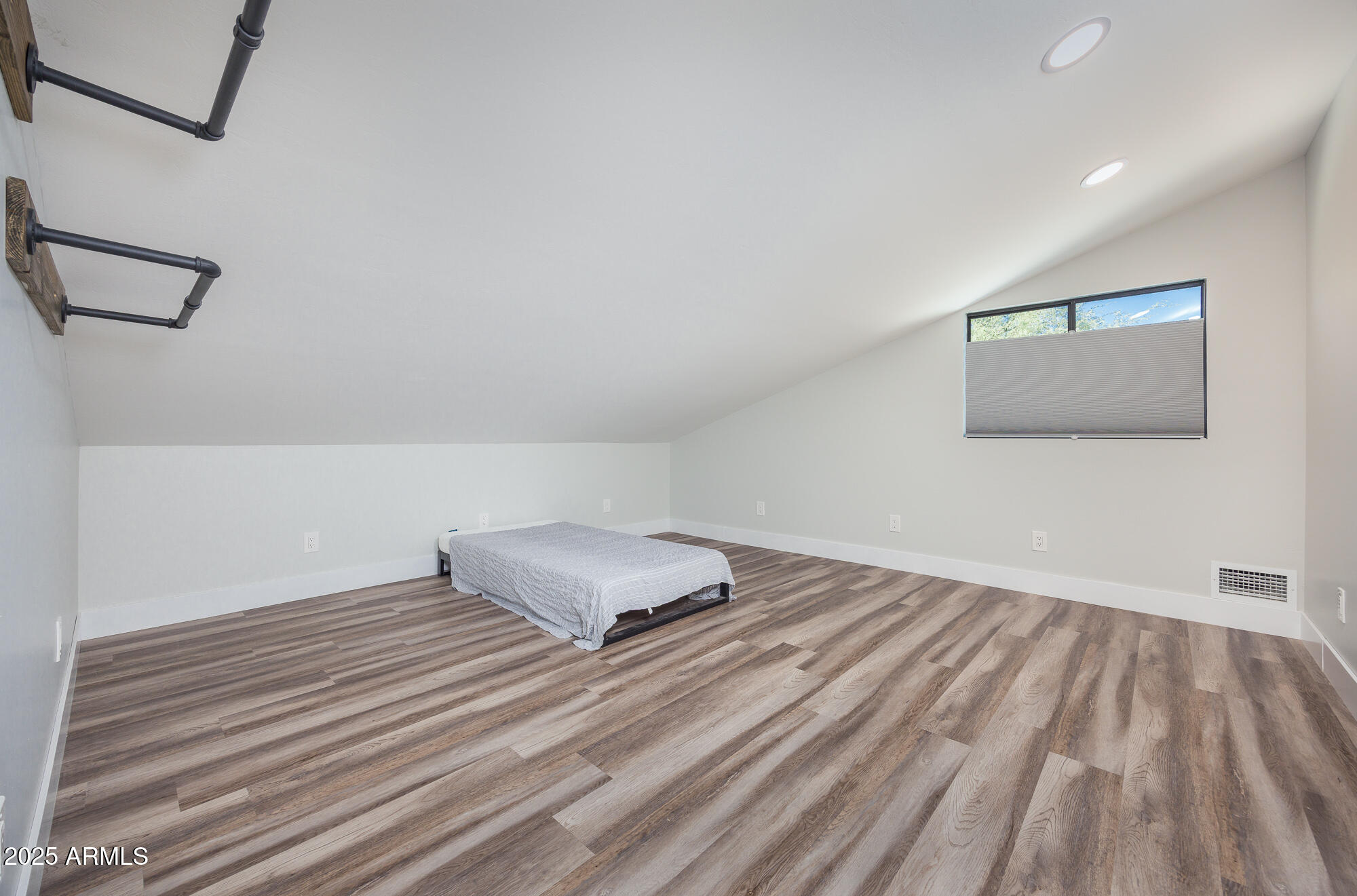 1302 West Coyote Trail Benson, AZ 85602 - Photo 21 of 57 a view of a room with wooden floor and fan