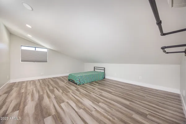 a spacious bathroom with a shower sink and mirror