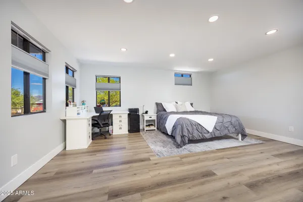 a view of walk in closet with clothes