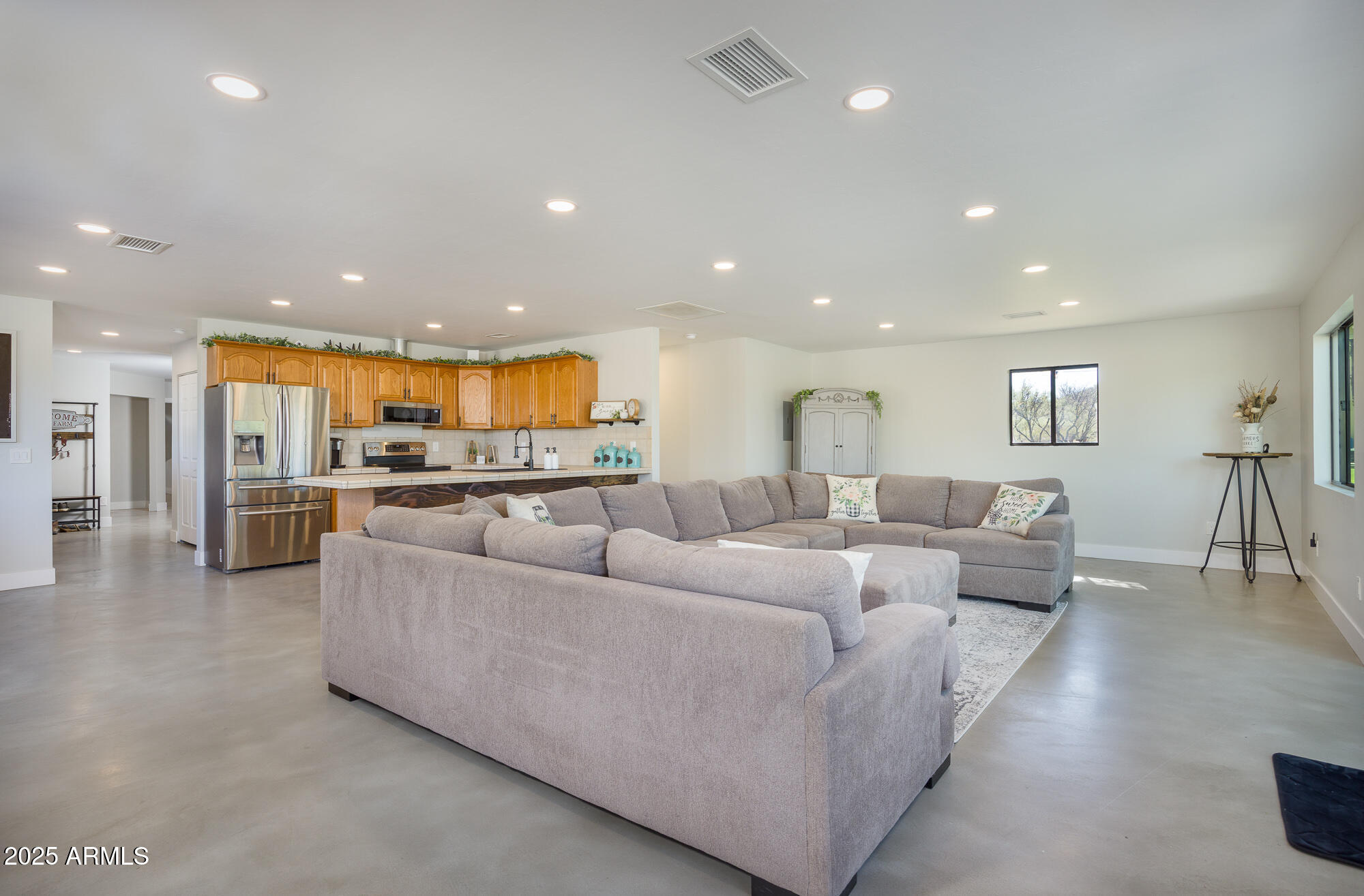 1302 West Coyote Trail Benson, AZ 85602 - Photo 38 of 57 a living room with furniture and a view of kitchen