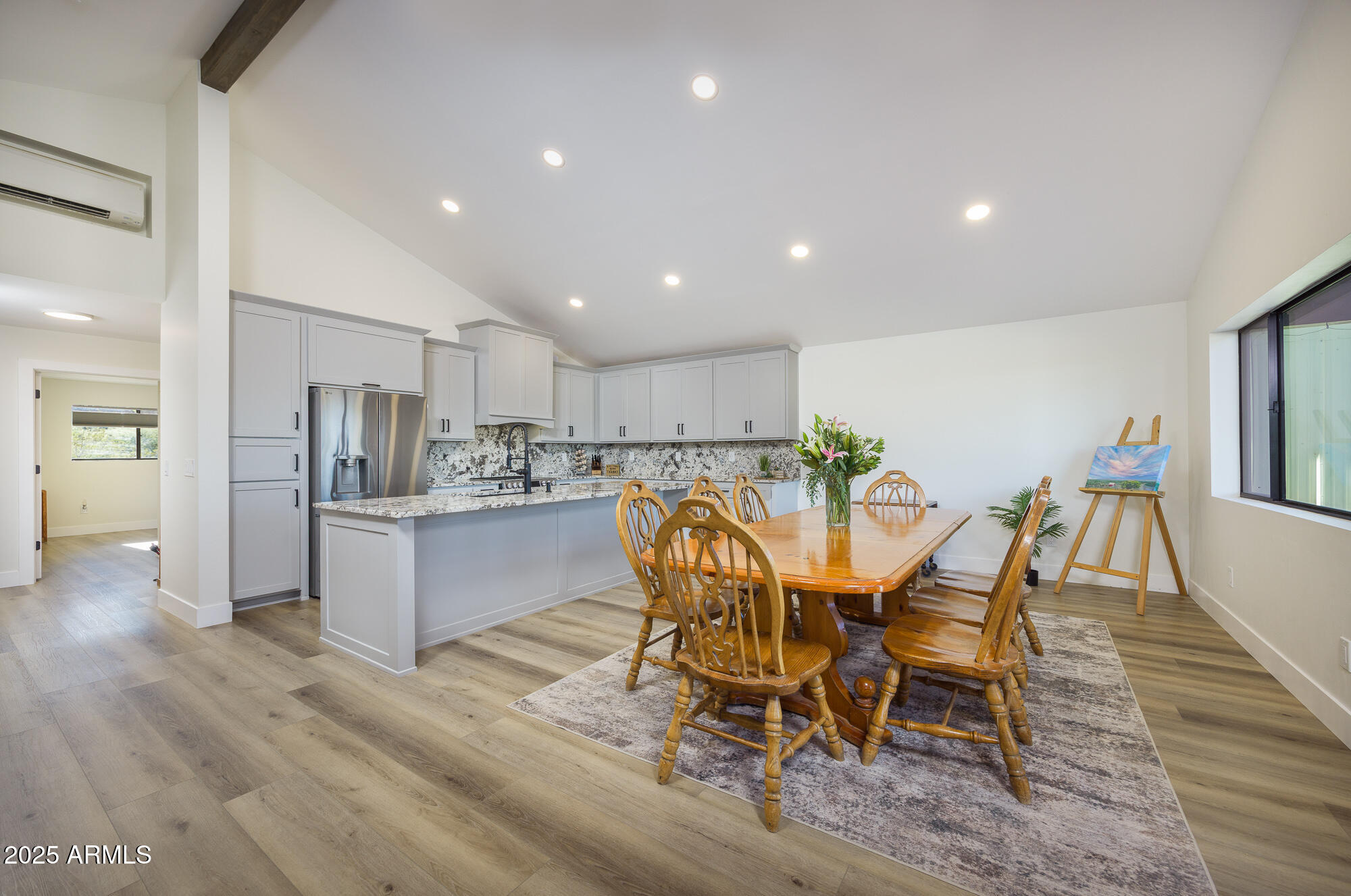 1302 West Coyote Trail Benson, AZ 85602 - Photo 4 of 57 a view of a dining room with furniture and wooden floor