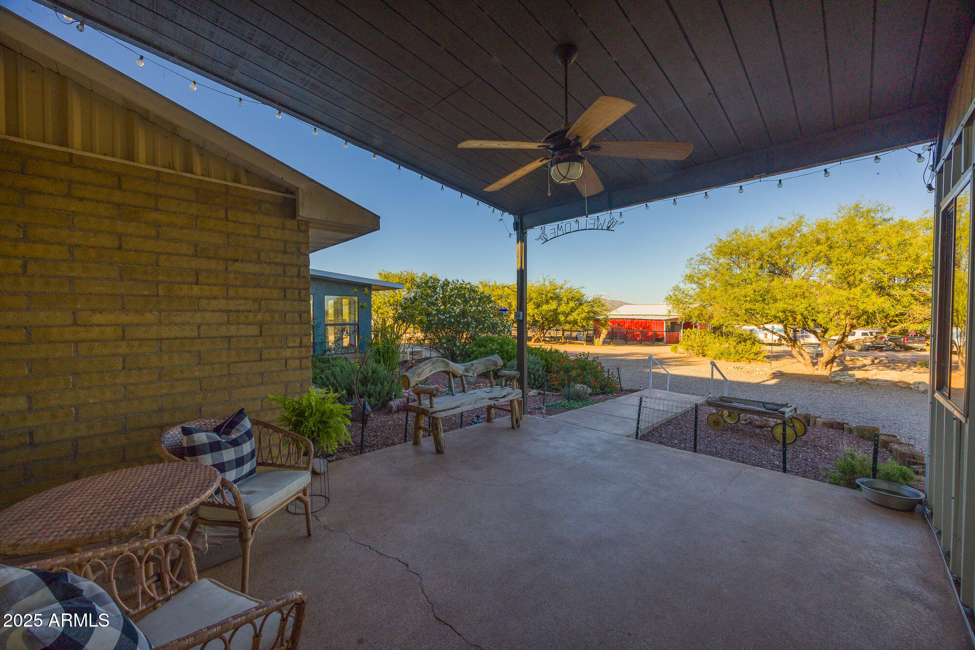1302 West Coyote Trail Benson, AZ 85602 - Photo 42 of 57 a view of a patio with a table and chairs under an umbrella