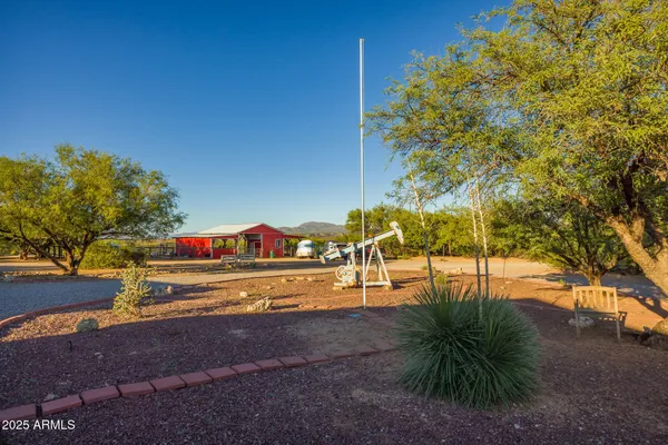 a view of swimming pool with outdoor seating and city view