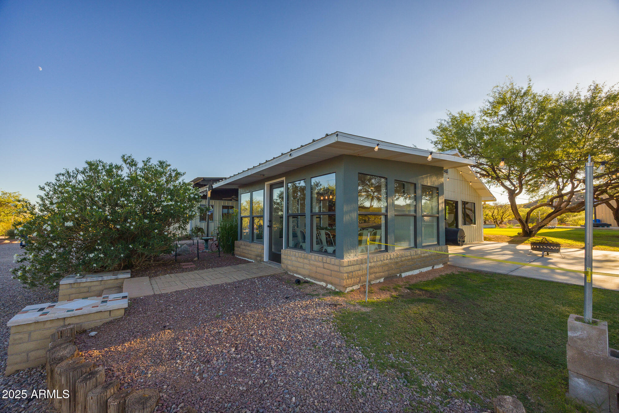 1302 West Coyote Trail Benson, AZ 85602 - Photo 45 of 57 a view of a house with a yard