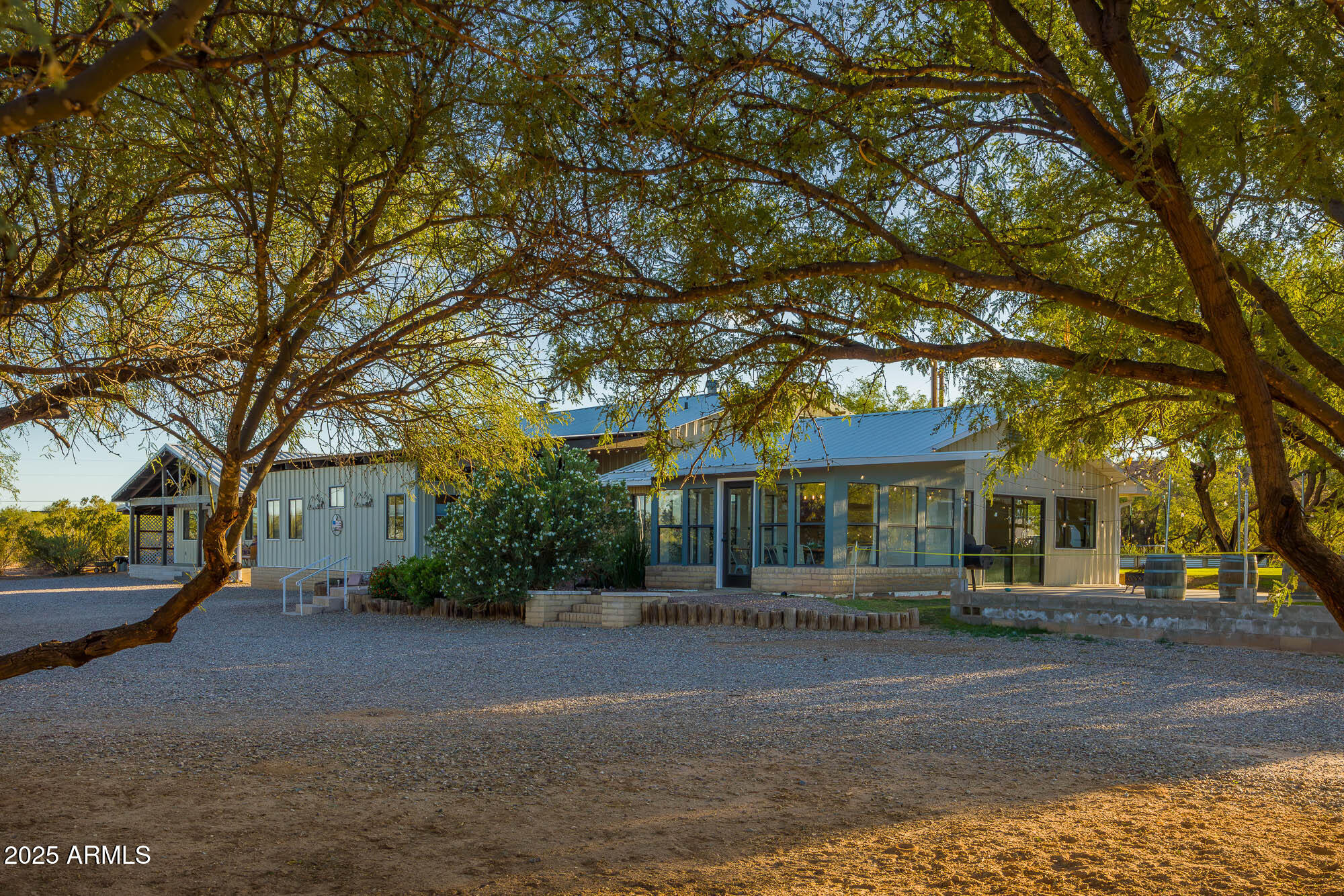 1302 West Coyote Trail Benson, AZ 85602 - Photo 49 of 57 a front view of a house with a garden
