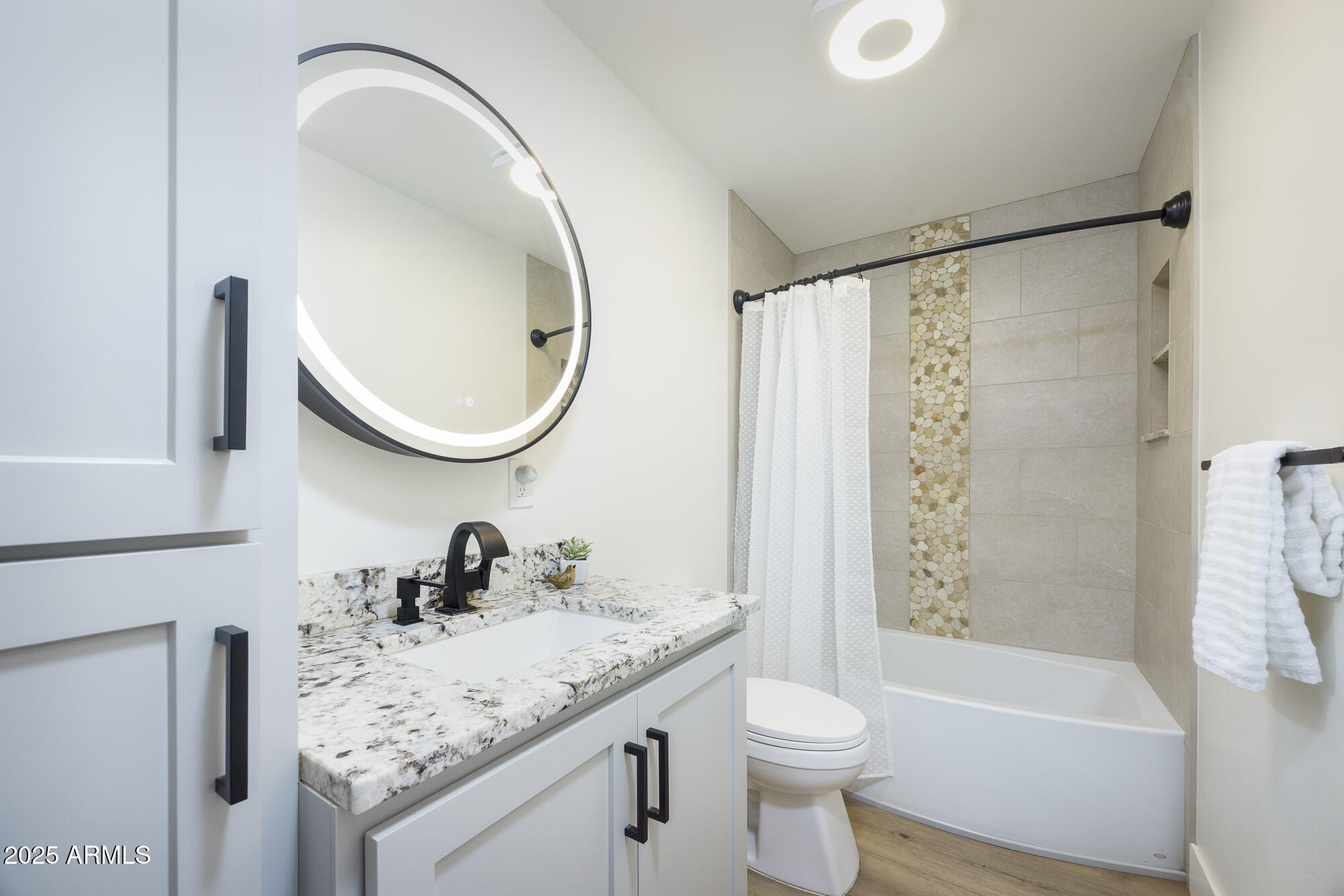 1302 West Coyote Trail Benson, AZ 85602 - Photo 10 of 57 a bathroom with a granite countertop sink toilet and a mirror