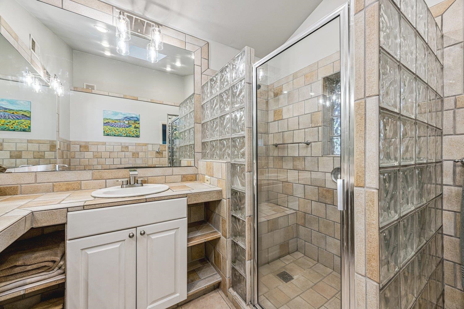 4220 Minden Road Memphis, TN 38117 - Photo 16 of 30 a bathroom with a shower sink and mirror