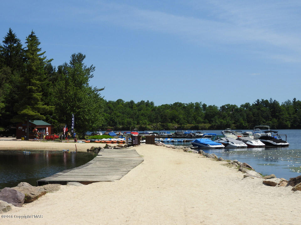 Moseywood Rd Lake Lake Harmony, PA 18624 - Photo 12 of 14 a view of swimming pool with outdoor seating and trees in the background