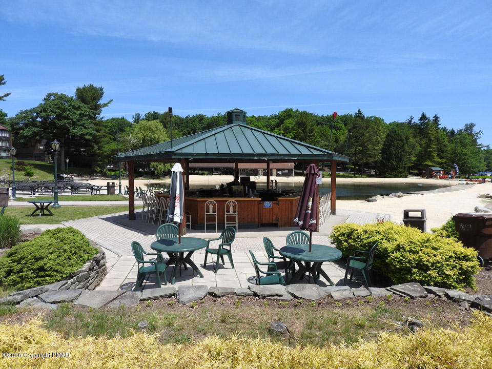 Moseywood Rd Lake Lake Harmony, PA 18624 - Photo 8 of 14 a view of a patio with table and chairs under an umbrella