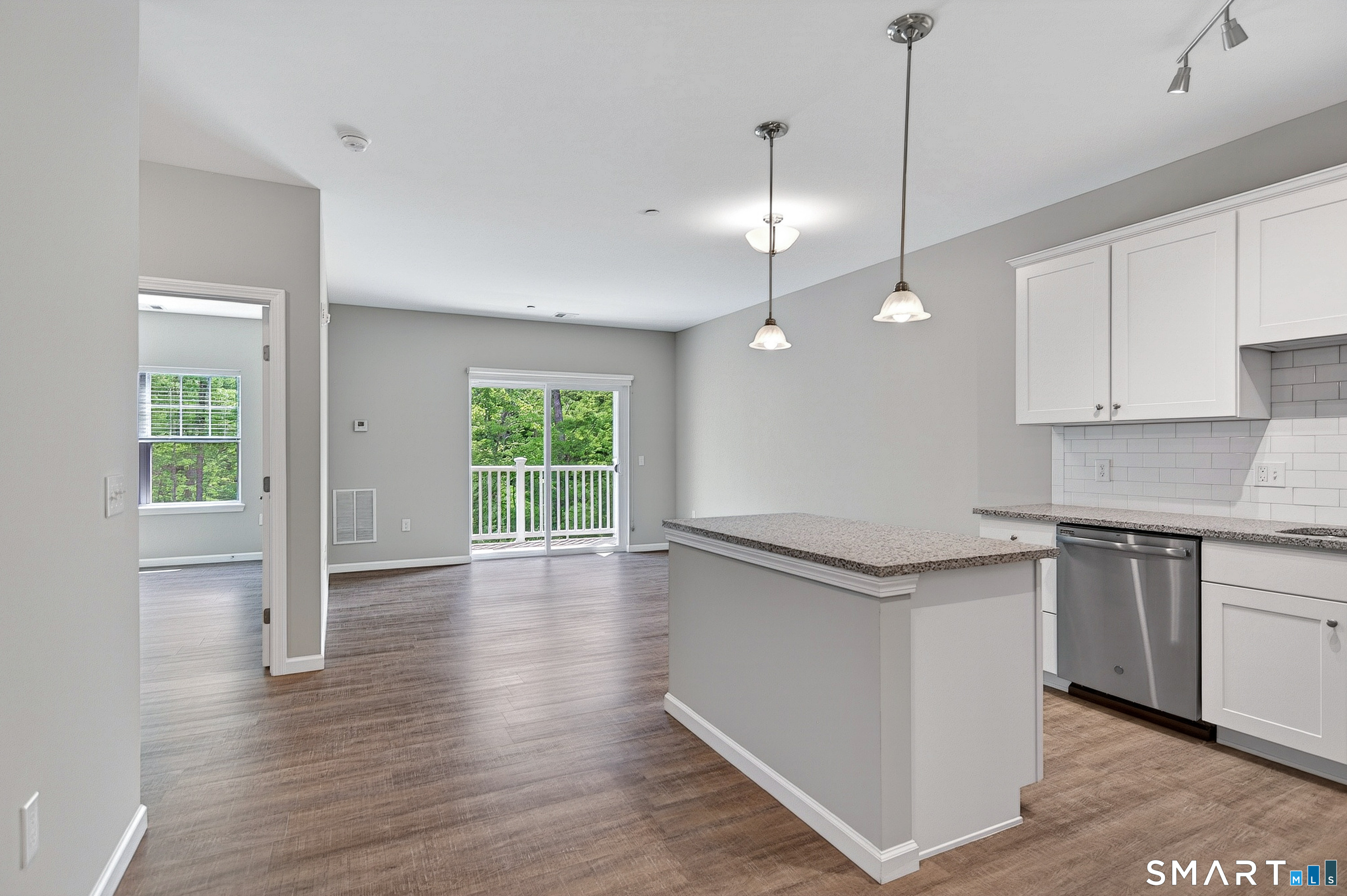 9 Covered Bridge Road, Unit 5107 Newtown, CT 06470 - Photo 5 of 27 White kitchen cabinets, quartz countertops and stainless steel appliances are found within every unit.