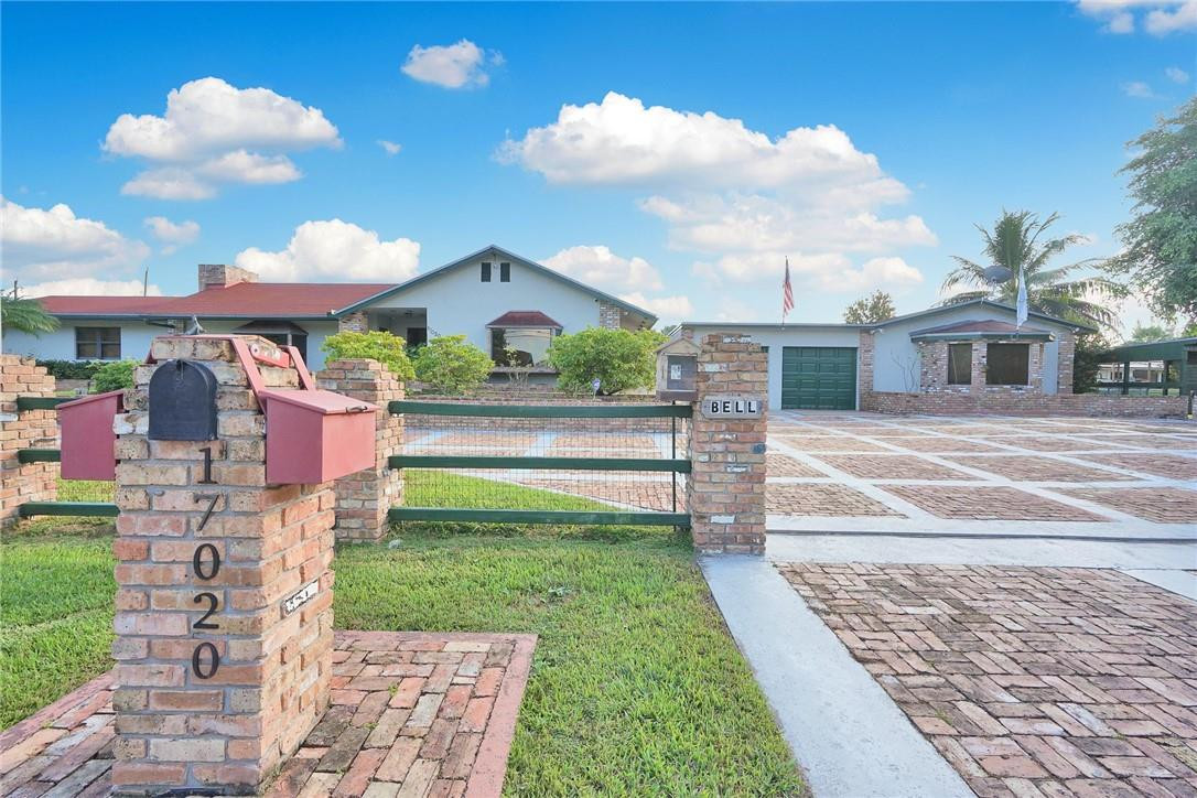 17020 Southwest 62nd Street Southwest Ranches, FL 33331 - Photo 1 of 44 a front view of a house with a yard