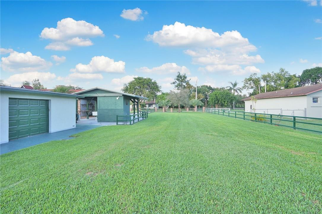 17020 Southwest 62nd Street Southwest Ranches, FL 33331 - Photo 14 of 44 a view of a backyard with a garden