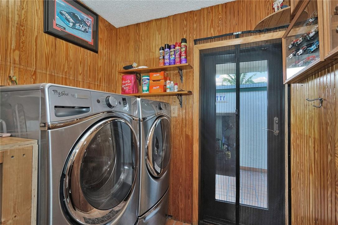 17020 Southwest 62nd Street Southwest Ranches, FL 33331 - Photo 19 of 44 a utility room with dryer and washer