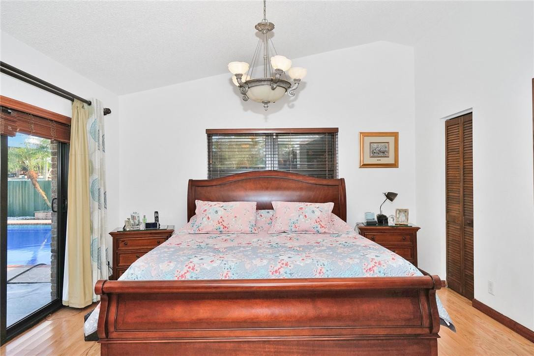 17020 Southwest 62nd Street Southwest Ranches, FL 33331 - Photo 36 of 44 a bedroom with a bed and window