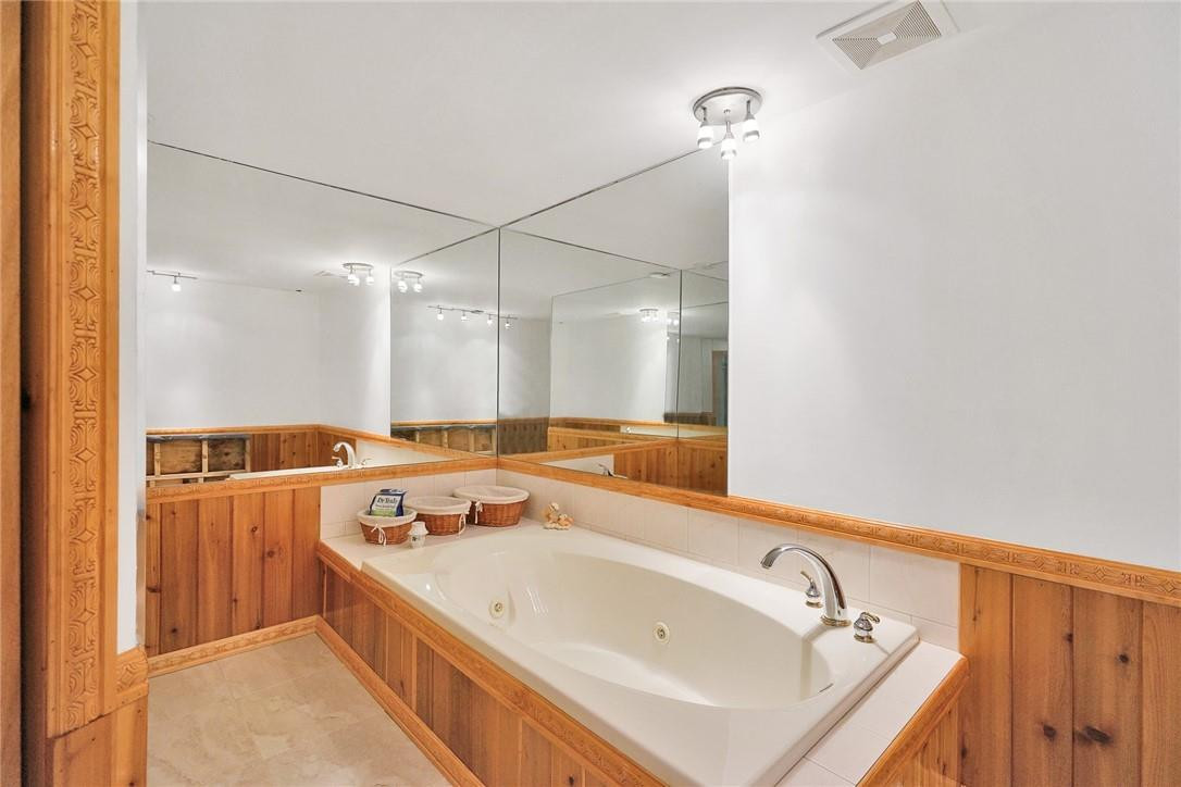 17020 Southwest 62nd Street Southwest Ranches, FL 33331 - Photo 39 of 44 a spacious bathroom with a tub sink and mirror
