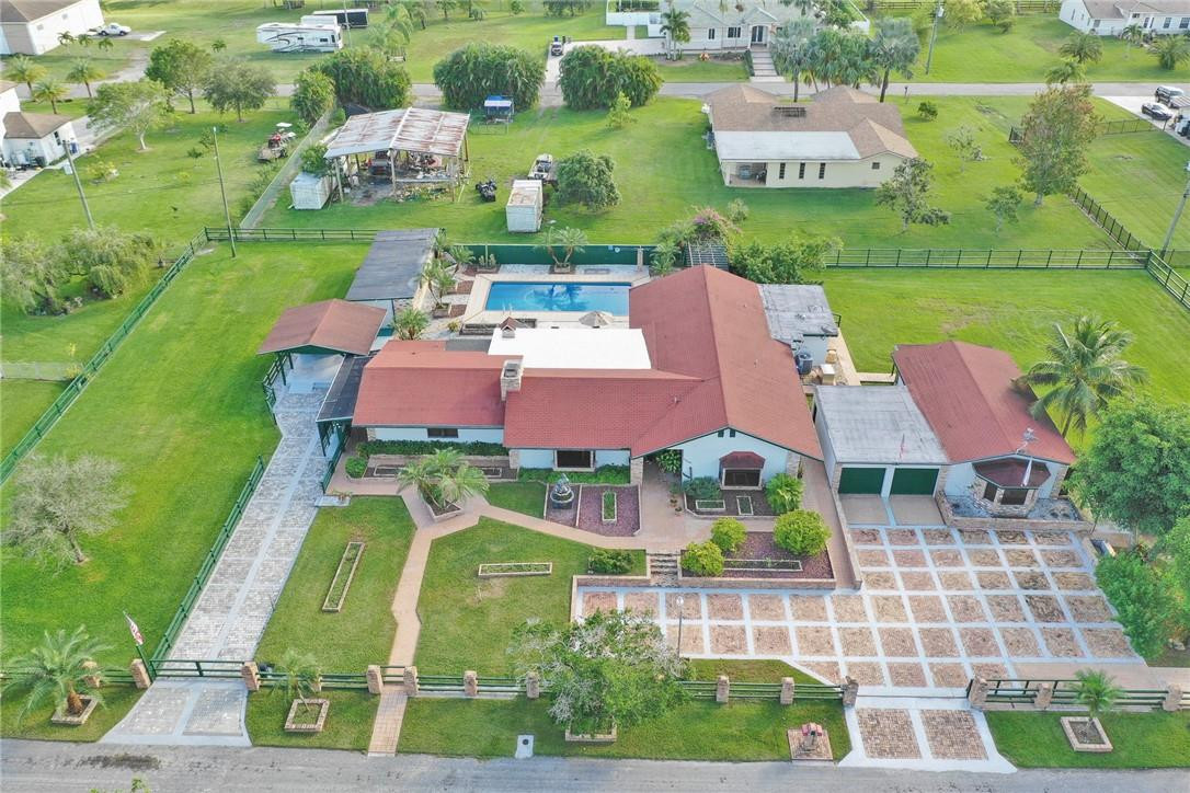17020 Southwest 62nd Street Southwest Ranches, FL 33331 - Photo 44 of 44 an aerial view of a house with outdoor space pool seating area and yard