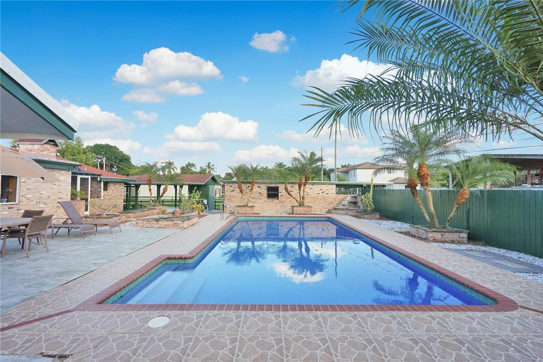 17020 Southwest 62nd Street Southwest Ranches, FL 33331 - Photo 7 of 44 a view of a swimming pool with a lounge chair