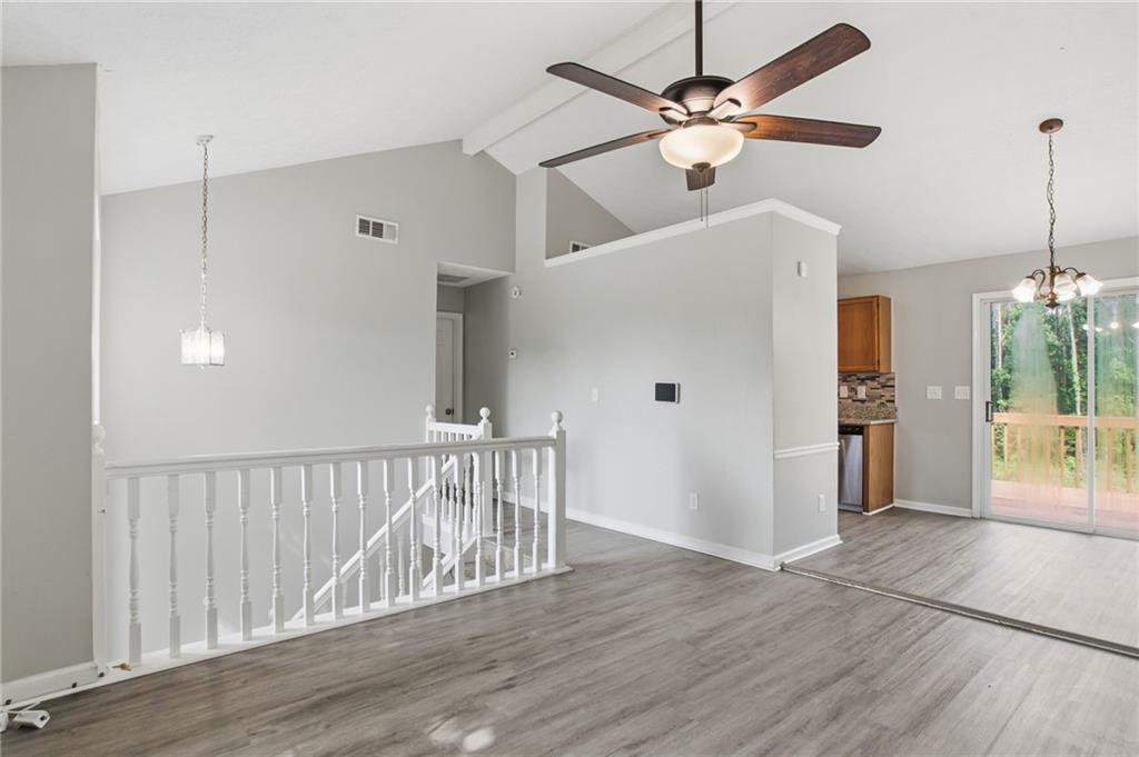 5855 Crescent Ridge Court Lithonia, GA 30058 - Photo 13 of 46 a view of an empty room with a window and wooden floor