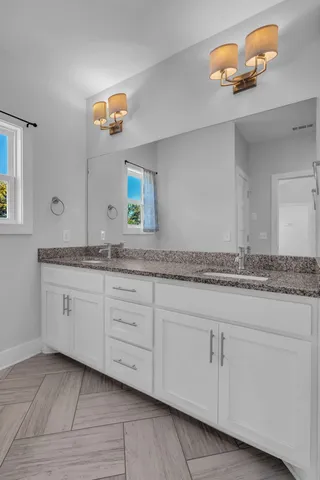 a view of a utility room with closet and windows