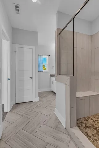 a bathroom with a sink and a shower