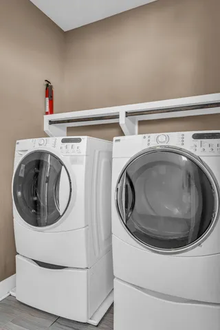 a balcony with wooden floor and trees