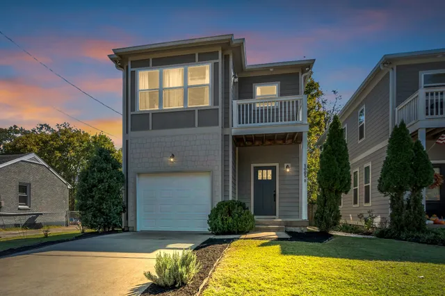 an aerial view of residential house with outdoor space and lake view
