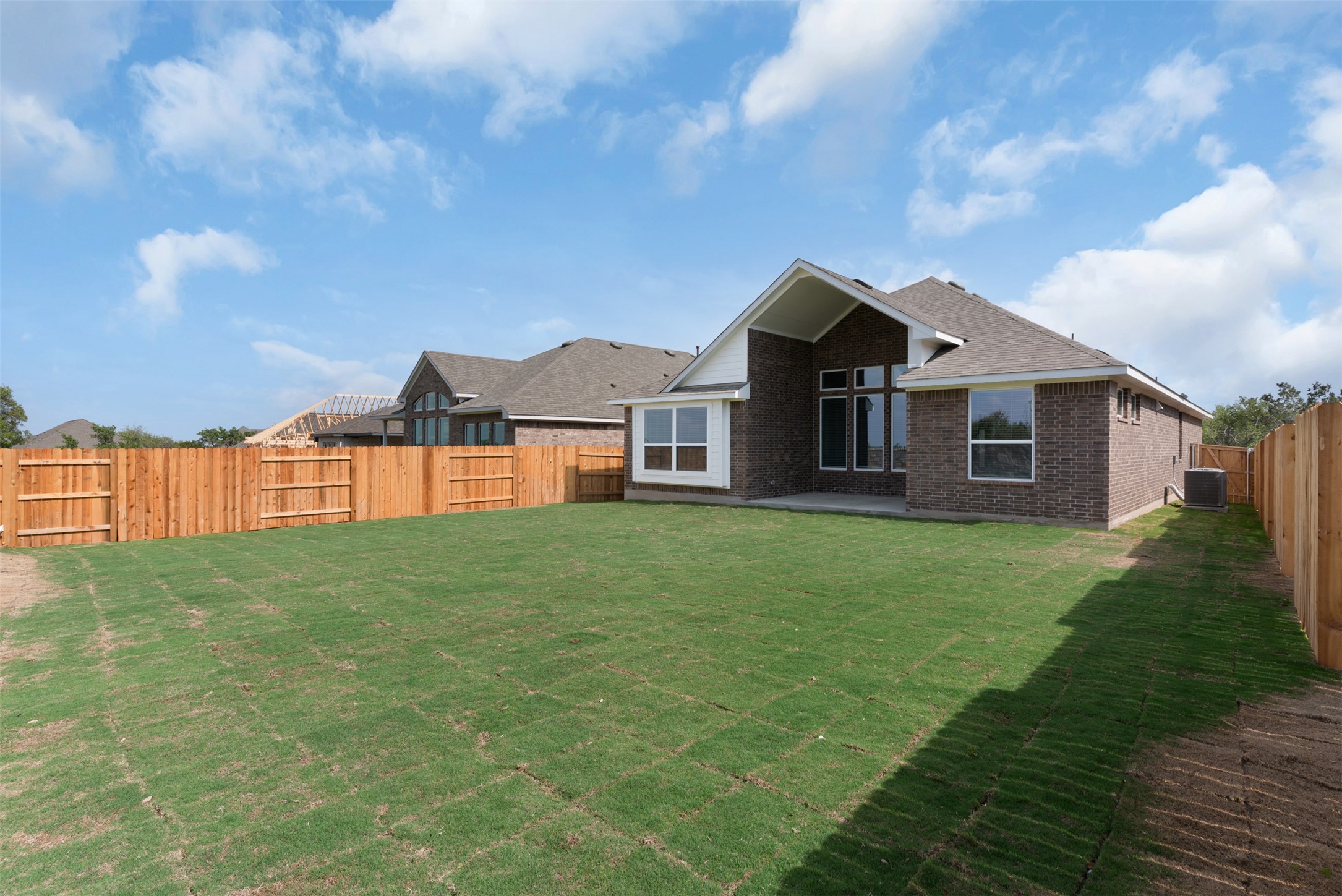 1121 Pansy Trail Georgetown, TX 78628 - Photo 17 of 25 Rear view of house featuring a patio, a fenced backyard, and brick siding