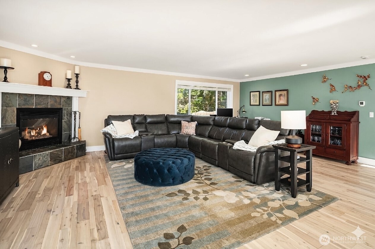 4014 Southwest 98th Street Seattle, WA 98136 - Photo 9 of 36 a living room with furniture and a fireplace