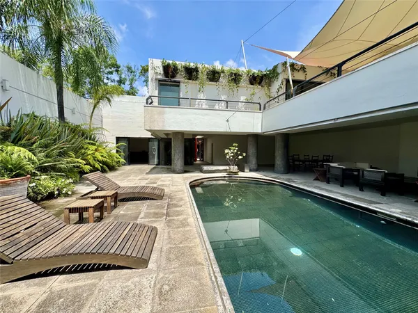 a view of a swimming pool with a patio