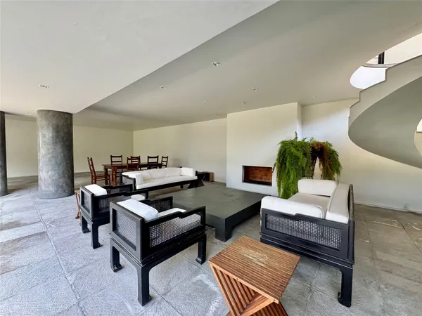 a living room with furniture and a rug