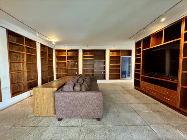 a living room with a couch and a flat screen tv