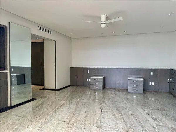a view of an entryway with a flower in a room