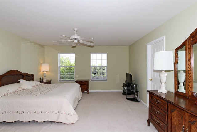409 Inverness Drive Gurnee, IL 60031 - Photo 15 of 25 a bedroom with a bed dresser and a window