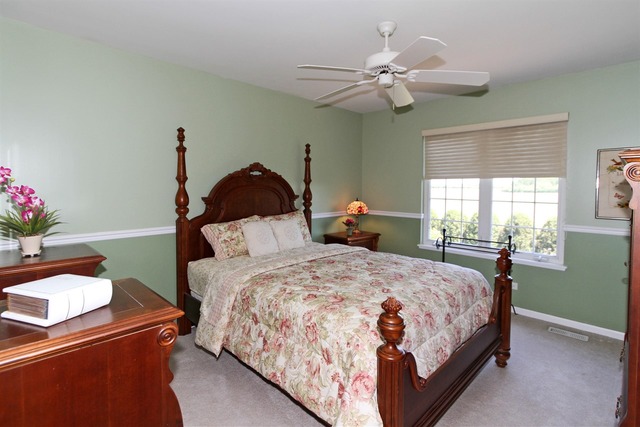 409 Inverness Drive Gurnee, IL 60031 - Photo 19 of 25 a bedroom with a bed and window