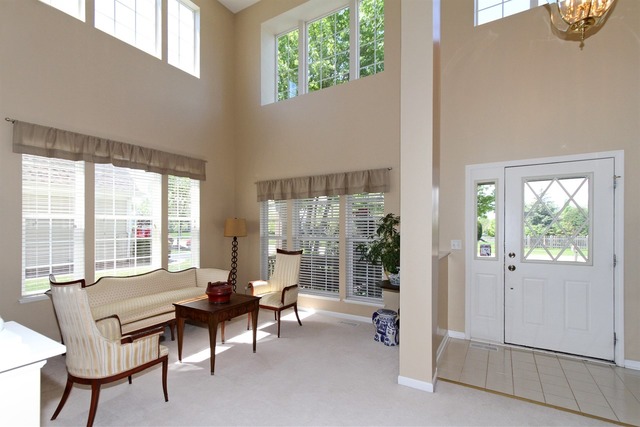 409 Inverness Drive Gurnee, IL 60031 - Photo 4 of 25 a living room with furniture and a large window