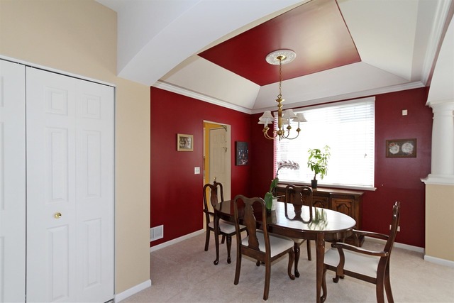 409 Inverness Drive Gurnee, IL 60031 - Photo 7 of 25 a view of a dining room with furniture and window