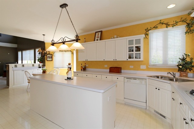 409 Inverness Drive Gurnee, IL 60031 - Photo 9 of 25 a kitchen with cabinets a sink and appliances